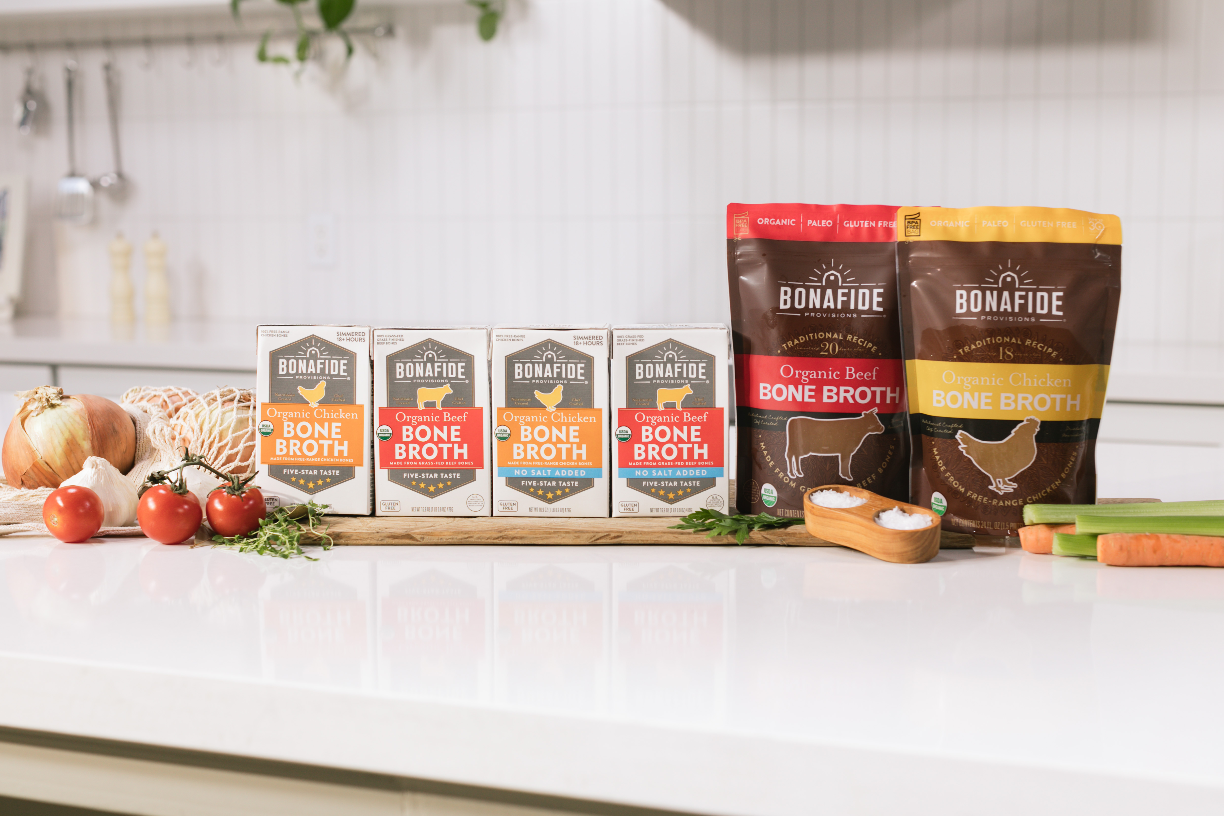row of three cups of bone broth with organic ingredients row of three cups of bone broth with organic ingredients