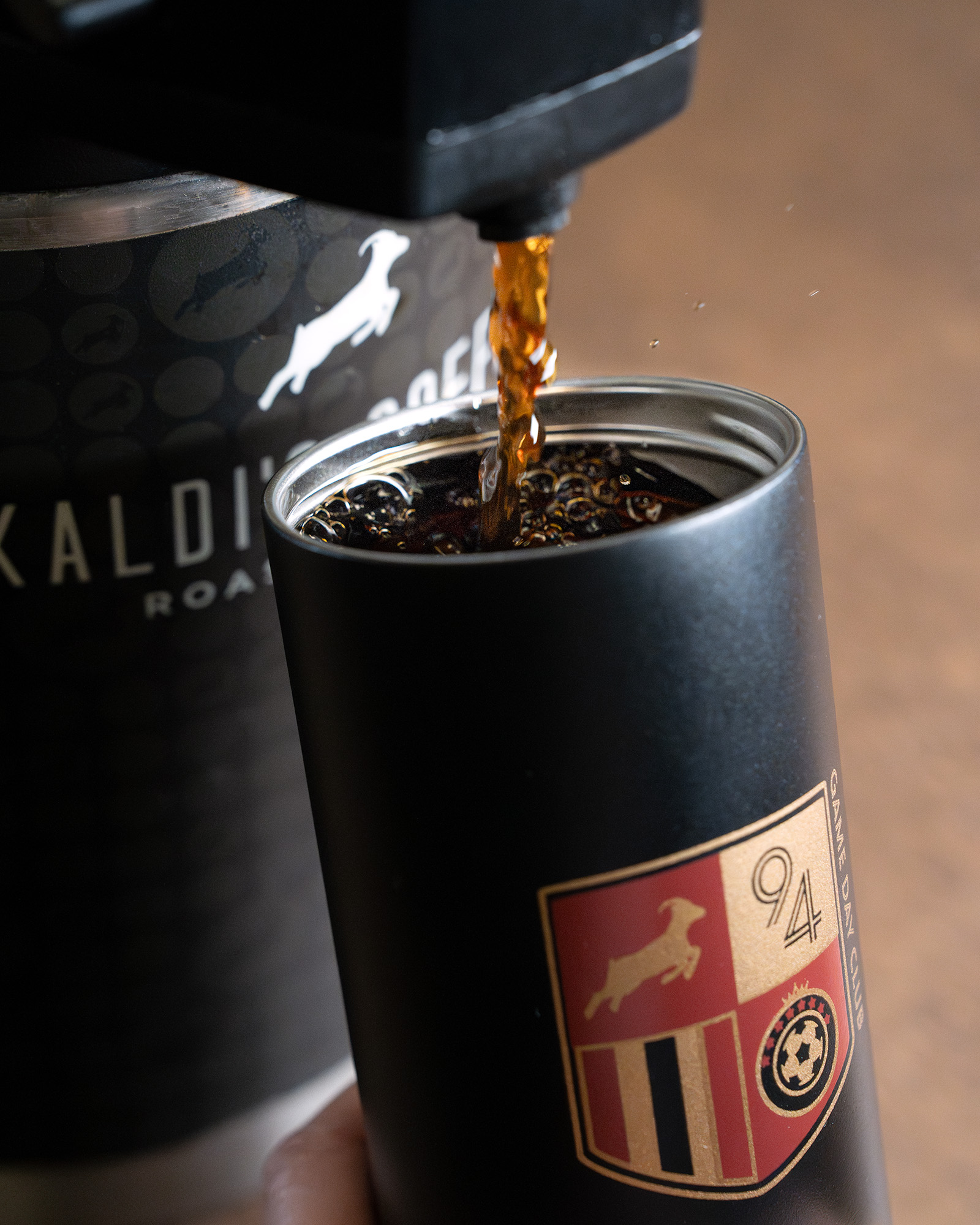 image of game day tumbler being filled with drip coffee.